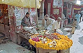 Varanasi - pilgrims purchasing flowers for puja 